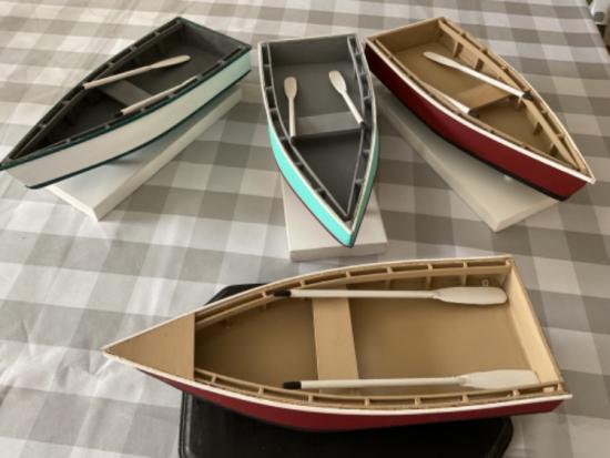 Small decorative wooden row boats