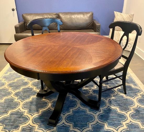 Round cherry finish table and 2 chairs